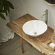 lavabo sobre mueble / de porcelana / redondo / sin orificio