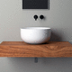 lavabo sobre mueble / de cerámica / con encimera / redondo