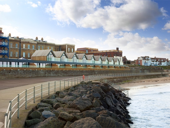 Guy Hollaway Architects termina las casas de la playa evocadoras de chozas británicas de la playa